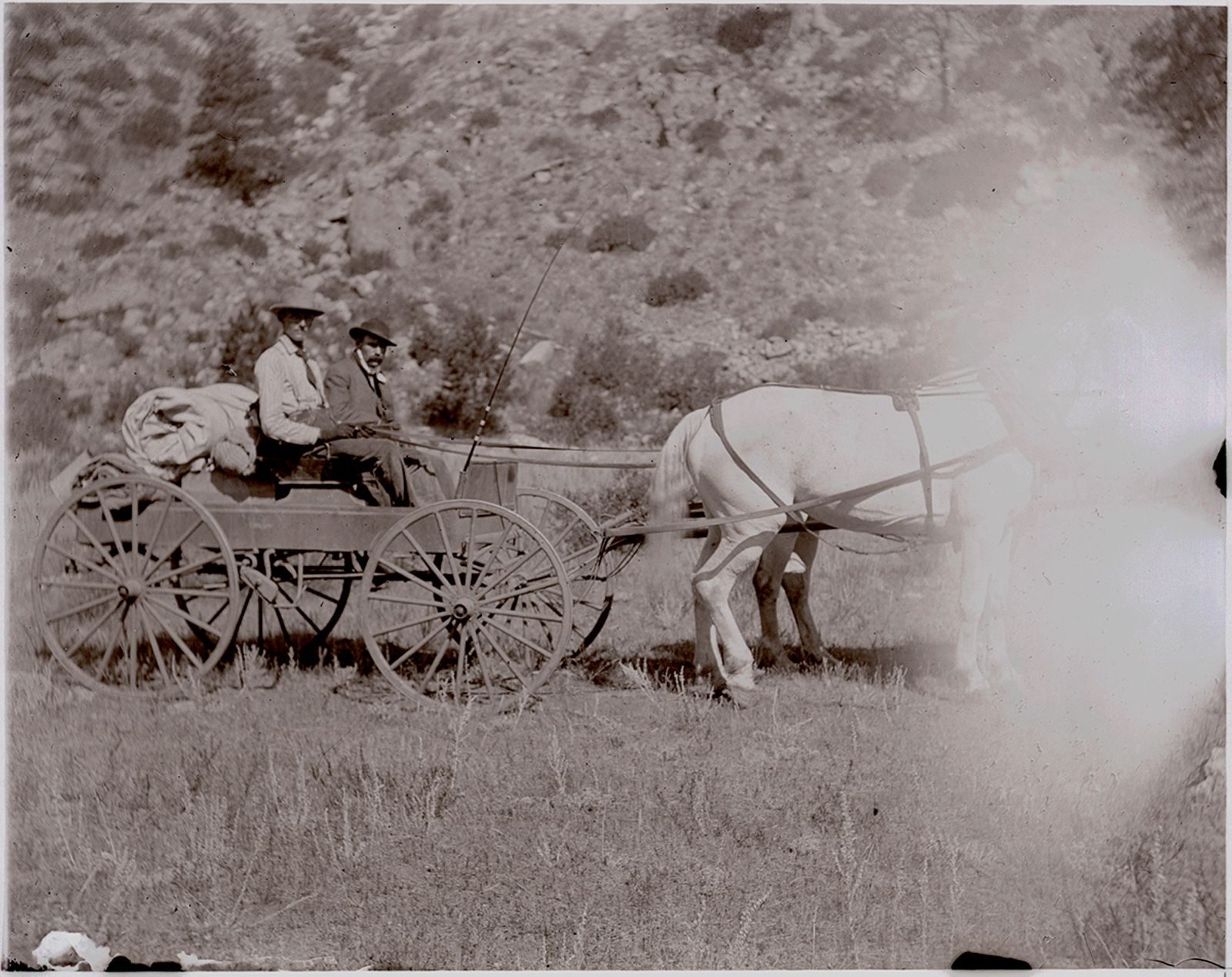 A photograph, 1903. Trimble and Lamb in wagon (Poudre River seepage trip).