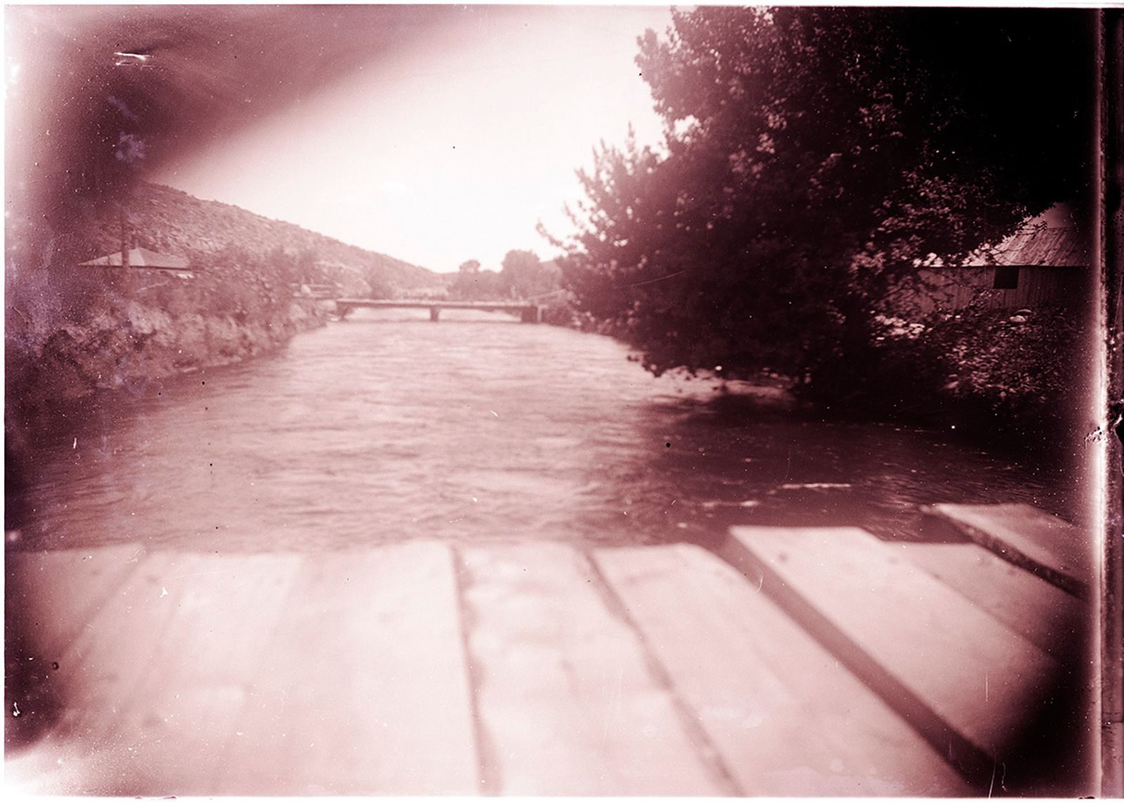 A photograph, 1903 July 6. Downstream from rating flume of Larimer County Canal.