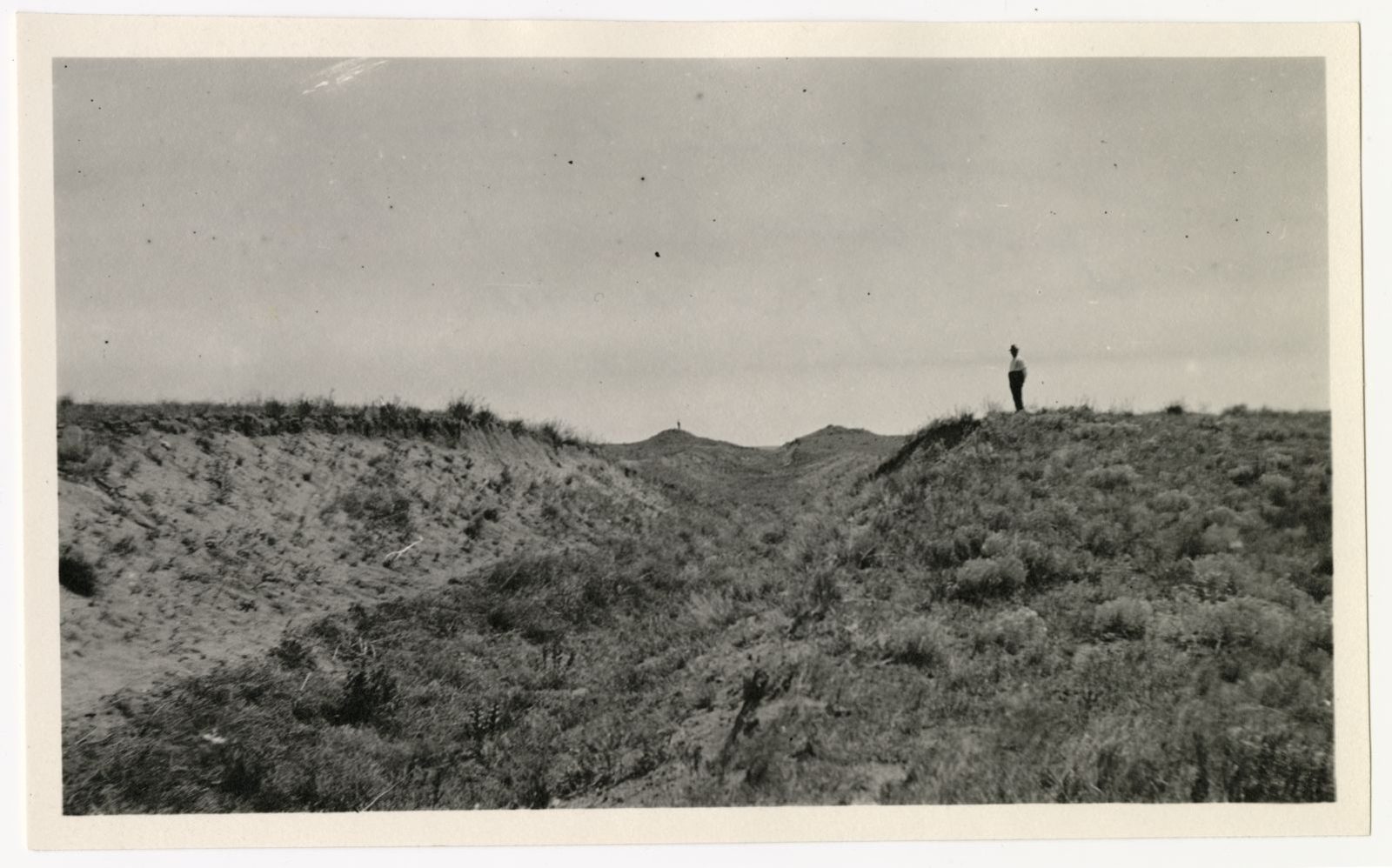 A photograph, 1918 June 24. Man standing at Perkins County Canal 1.