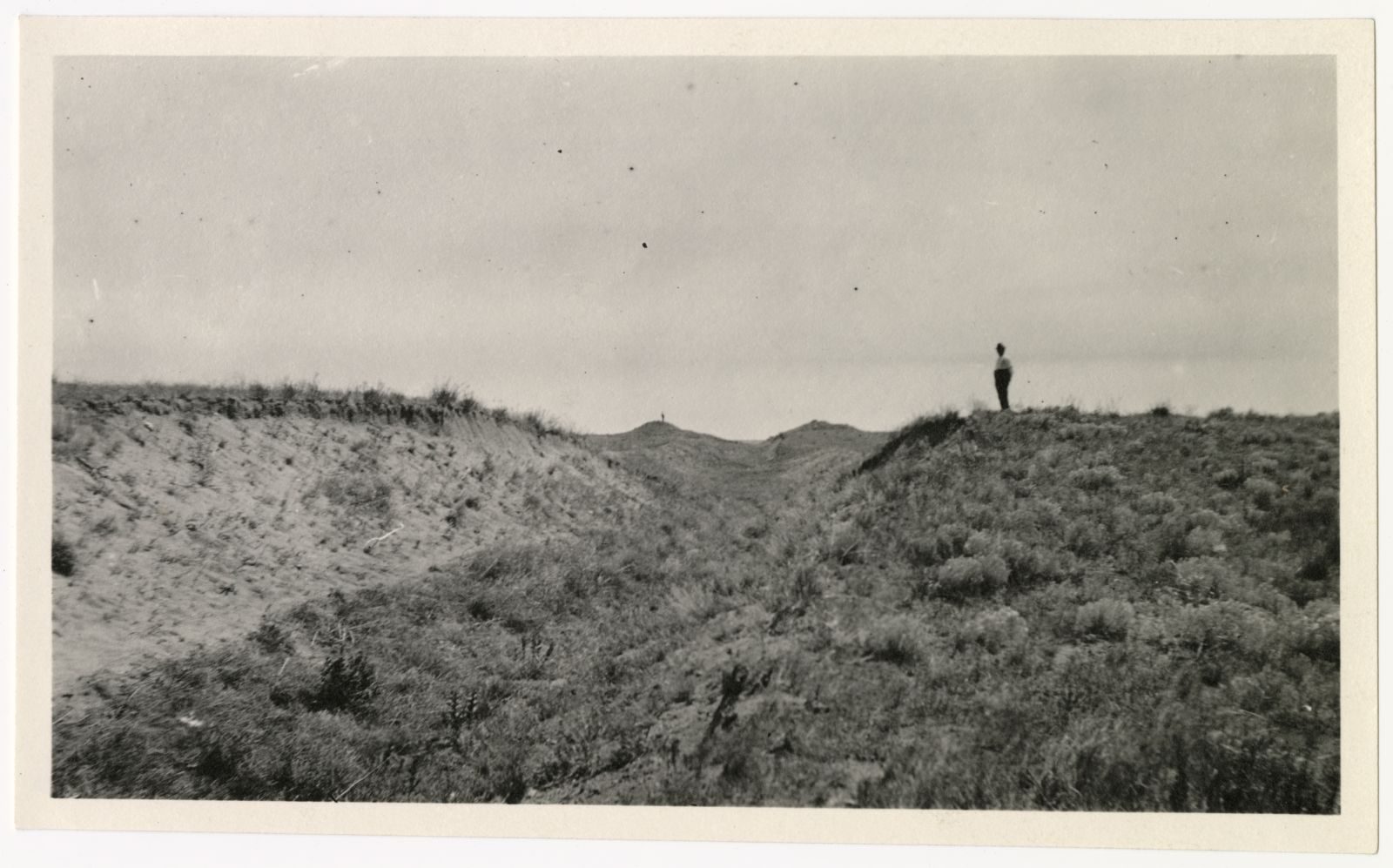 A photograph, 1918 June 24. Man standing at Perkins County Canal 2.
