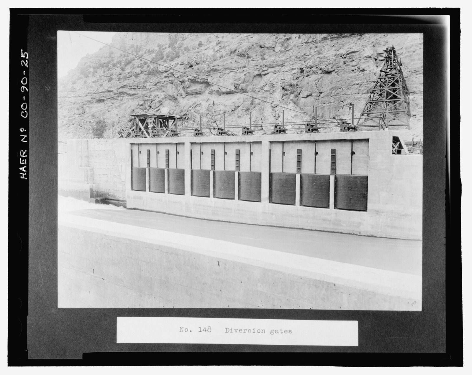 "No. 148. Diversion gates." These are the 9 headgates to the Main Line Canal. Note the cross-river cable way and associated pier.