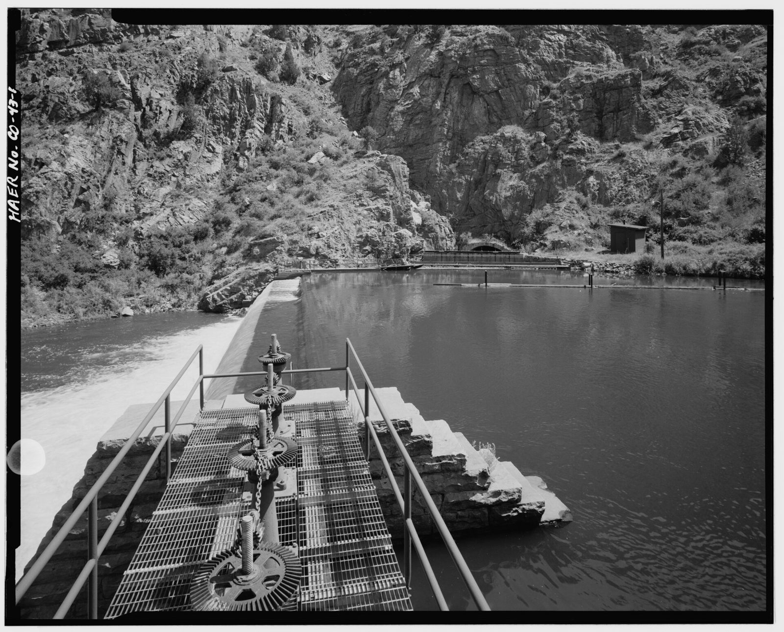 Canal headgate (right background) in Platte river canyon, with diversion dam in left foreground. View to southwest.