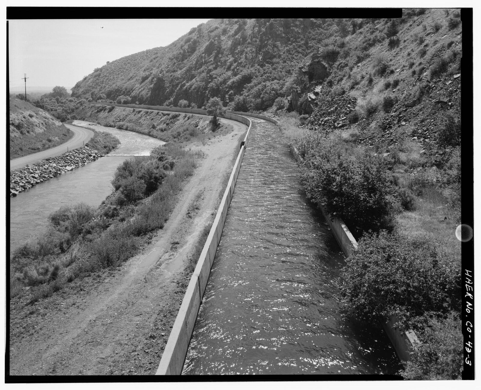 Canal flume in Platte river canyon, with South Platte river at left. View to east.