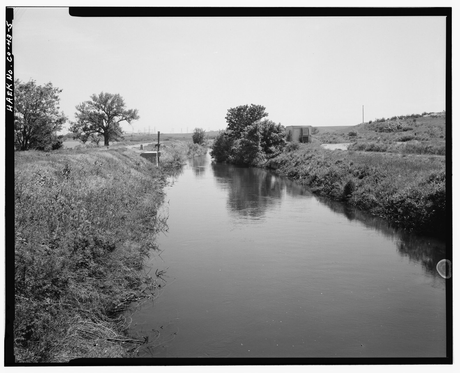 Typical section of canal, with lateral gates at left, view to southwest.