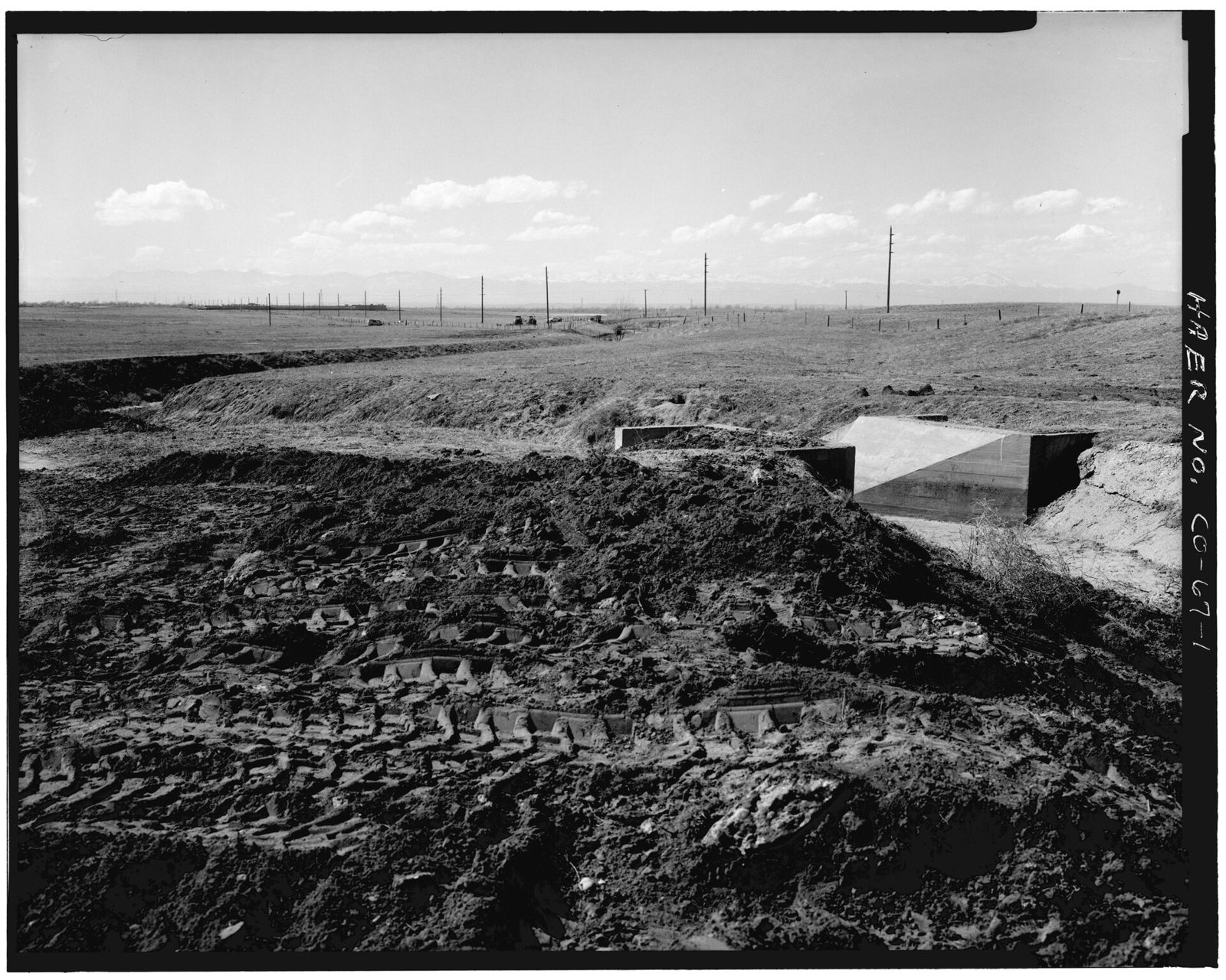 Overall view of lateral A with headgate, Highline extension canal, looking southeast.