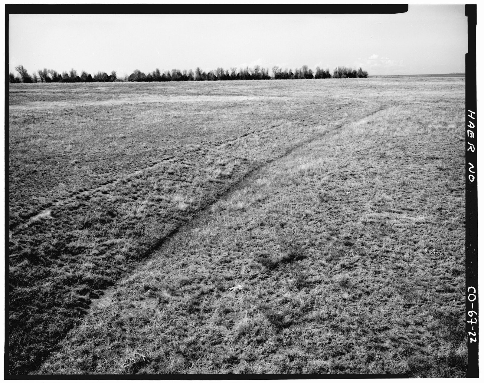 View of lateral G, looking south from bend at middle of lateral, curving to left in the background toward hudson road.