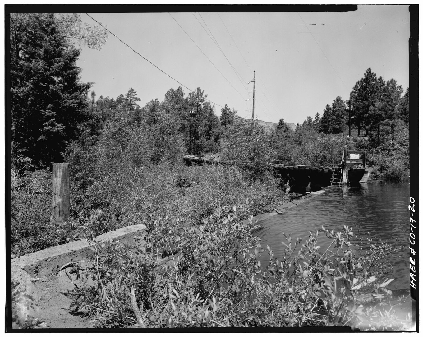 Side view; Flume emptying into forebay lake-1980.