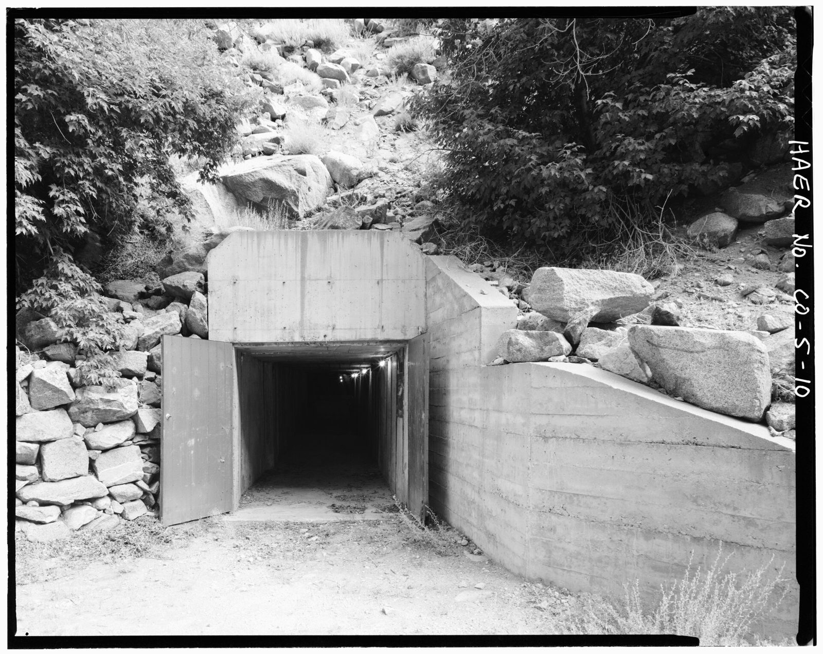 Entrance to adit -6 to the diversion tunnel, view to the north. This is the main access to the tunnel for maintenance operations and repairs.