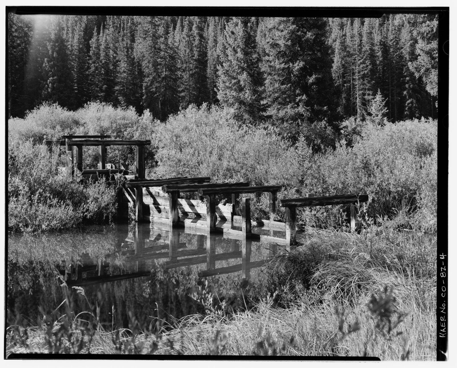 Headgate and flume at the beginning of the Snake River ditch passing through beaver pond area, looking east-southeast.