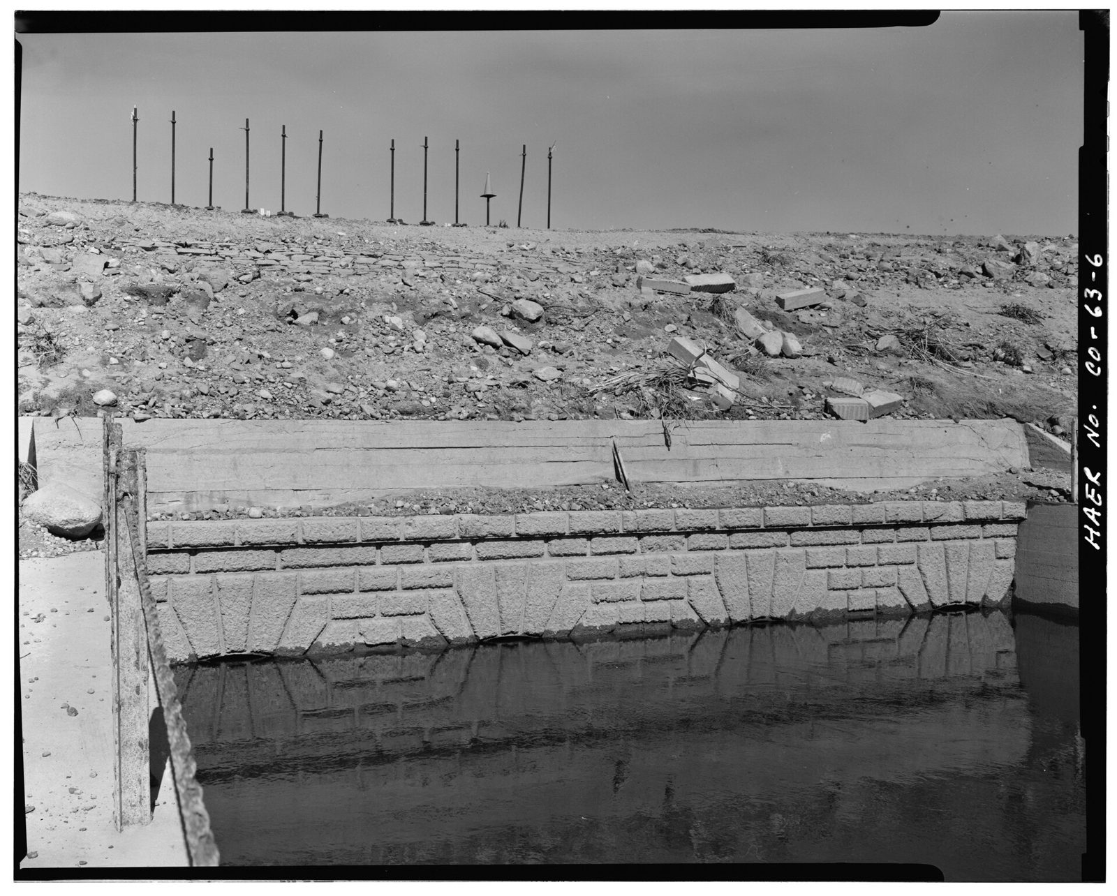 Detail view of the masonry facing on the downstream side of the historic outlet works. View looking northeast.